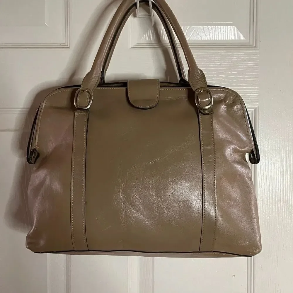 Tano Leather tan frame medium satchel gold tone hardwares .